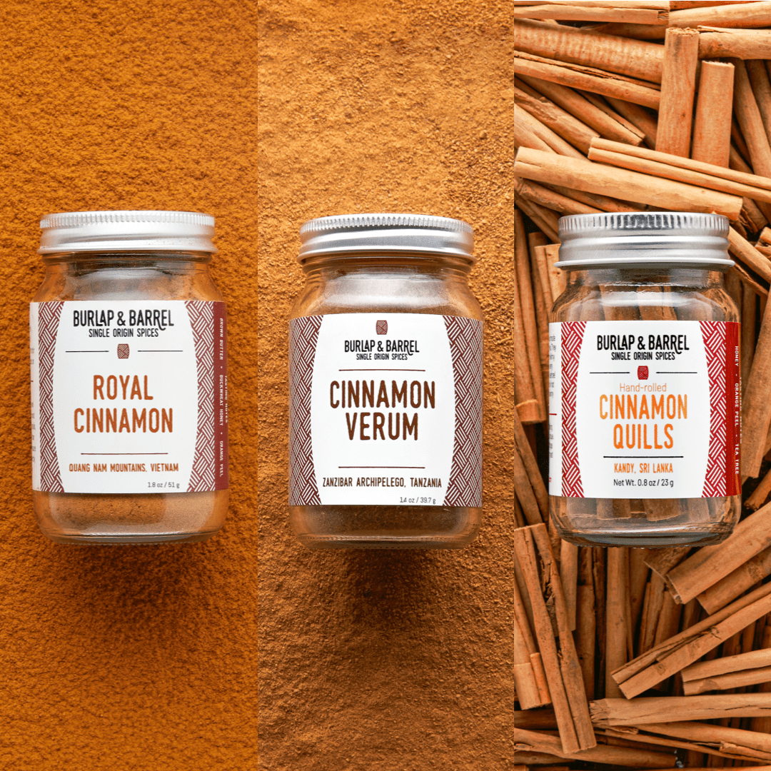 Three glass jars of Burlap & Barrel cinnamon products: Royal Cinnamon from Vietnam, Cinnamon Verum from Tanzania, and hand-rolled Cinnamon Quills from Sri Lanka, displayed against cinnamon powder and sticks.