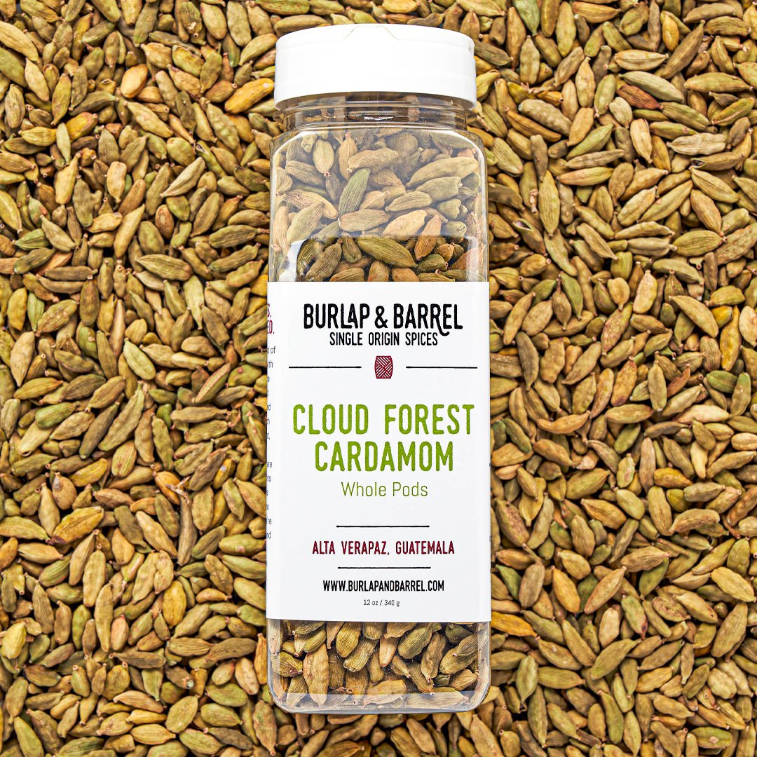Burlap & Barrel Cloud Forest Cardamom whole pods jar on cardamom pod background