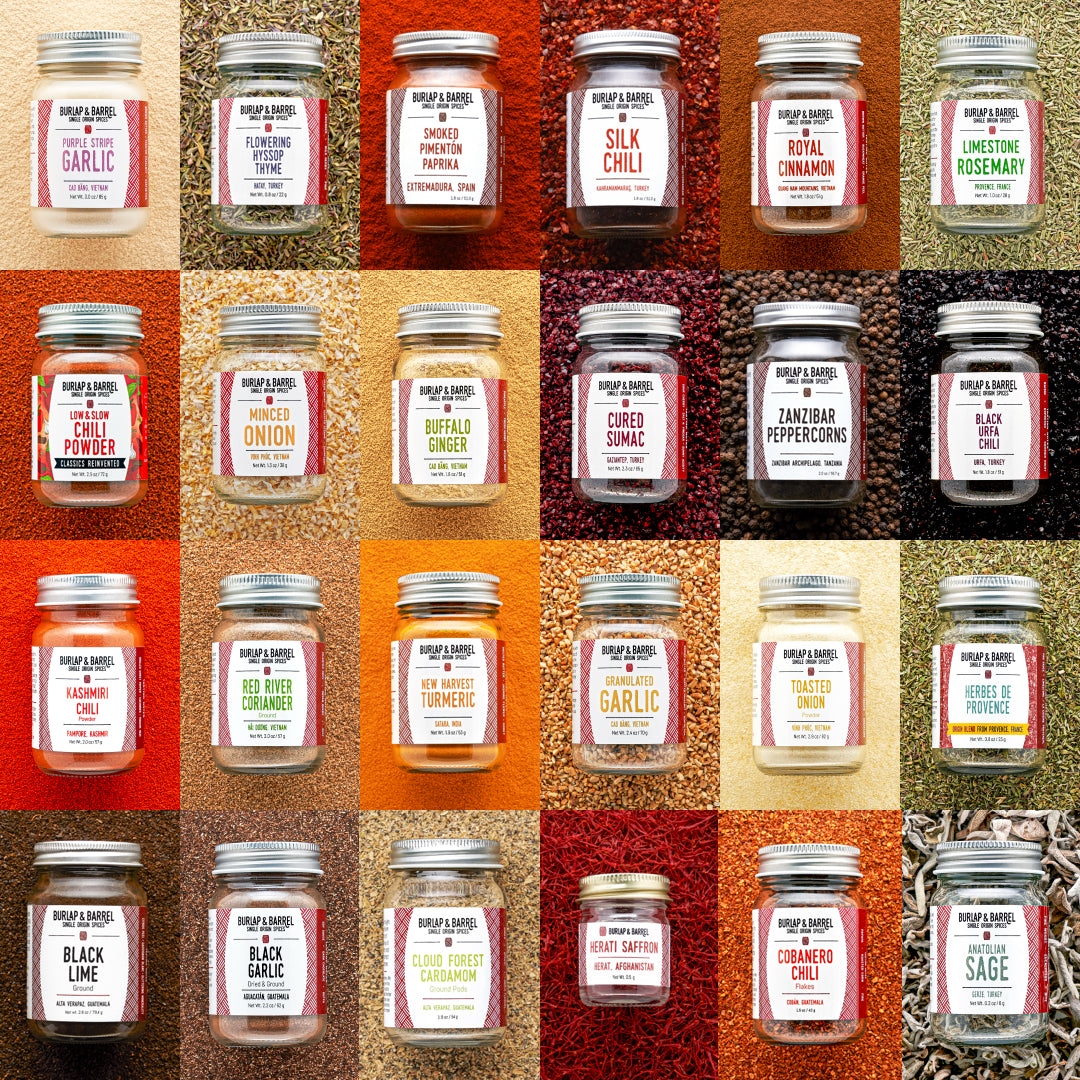 Grid of various spice jars with labels on a textured background