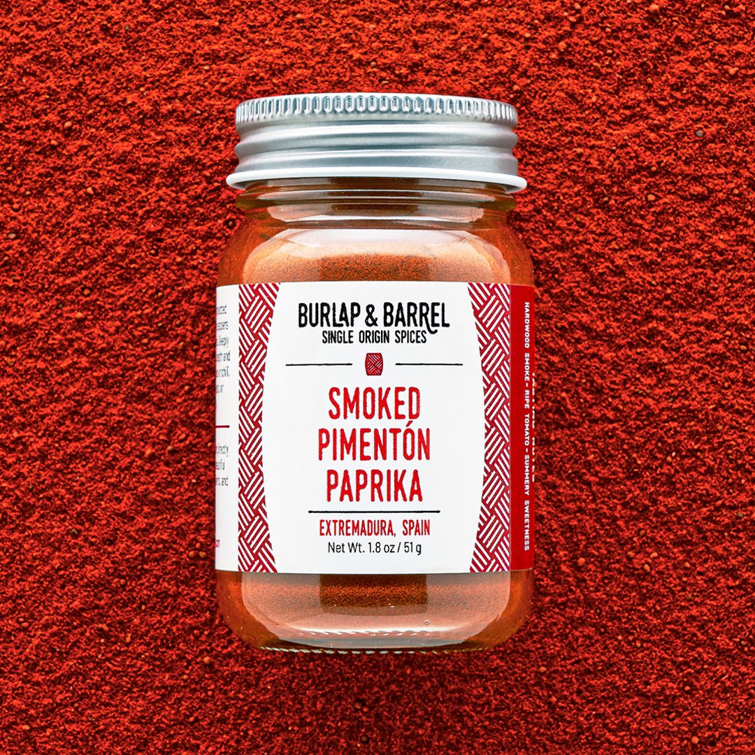 Burlap & Barrel Smoked Pimentón Paprika jar from Extremadura, Spain on paprika background