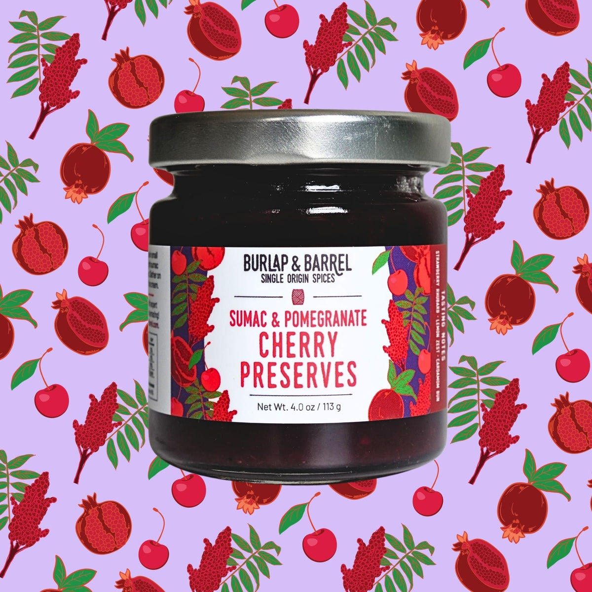 Jar of Burlap & Barrel Sumac & Pomegranate Cherry Preserves on a patterned background