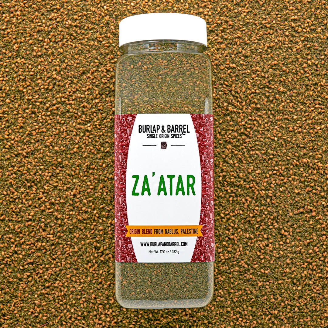 Jar of Za'atar spice blend from Burlap & Barrel on a textured brown background
