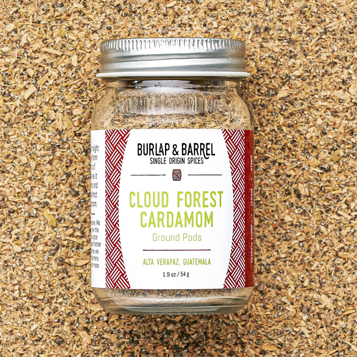 Burlap & Barrel Cloud Forest Cardamom ground pods spice jar on ground cardamom background