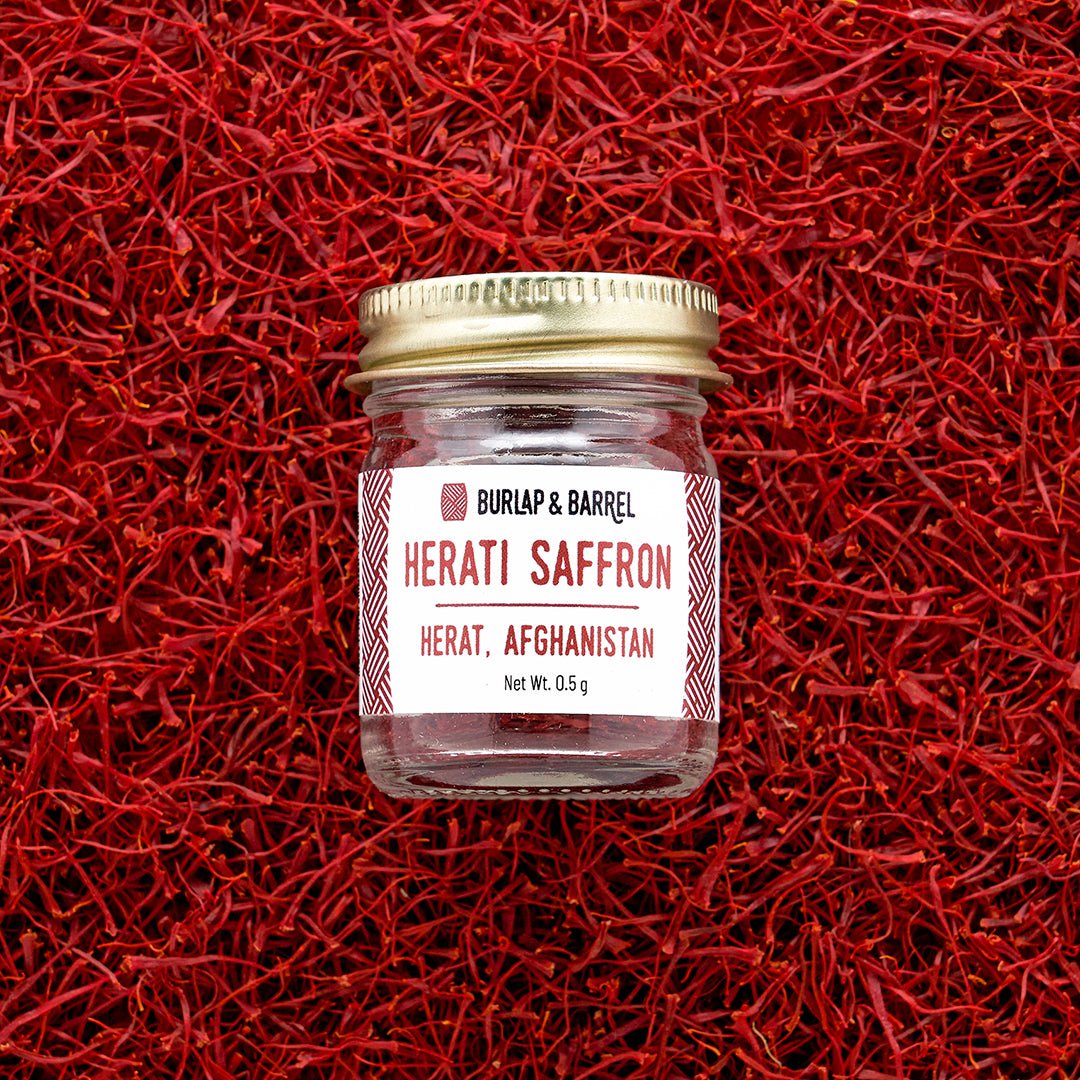 Herati Saffron from Afghanistan by Burlap & Barrel, 0.5g jar on red saffron threads