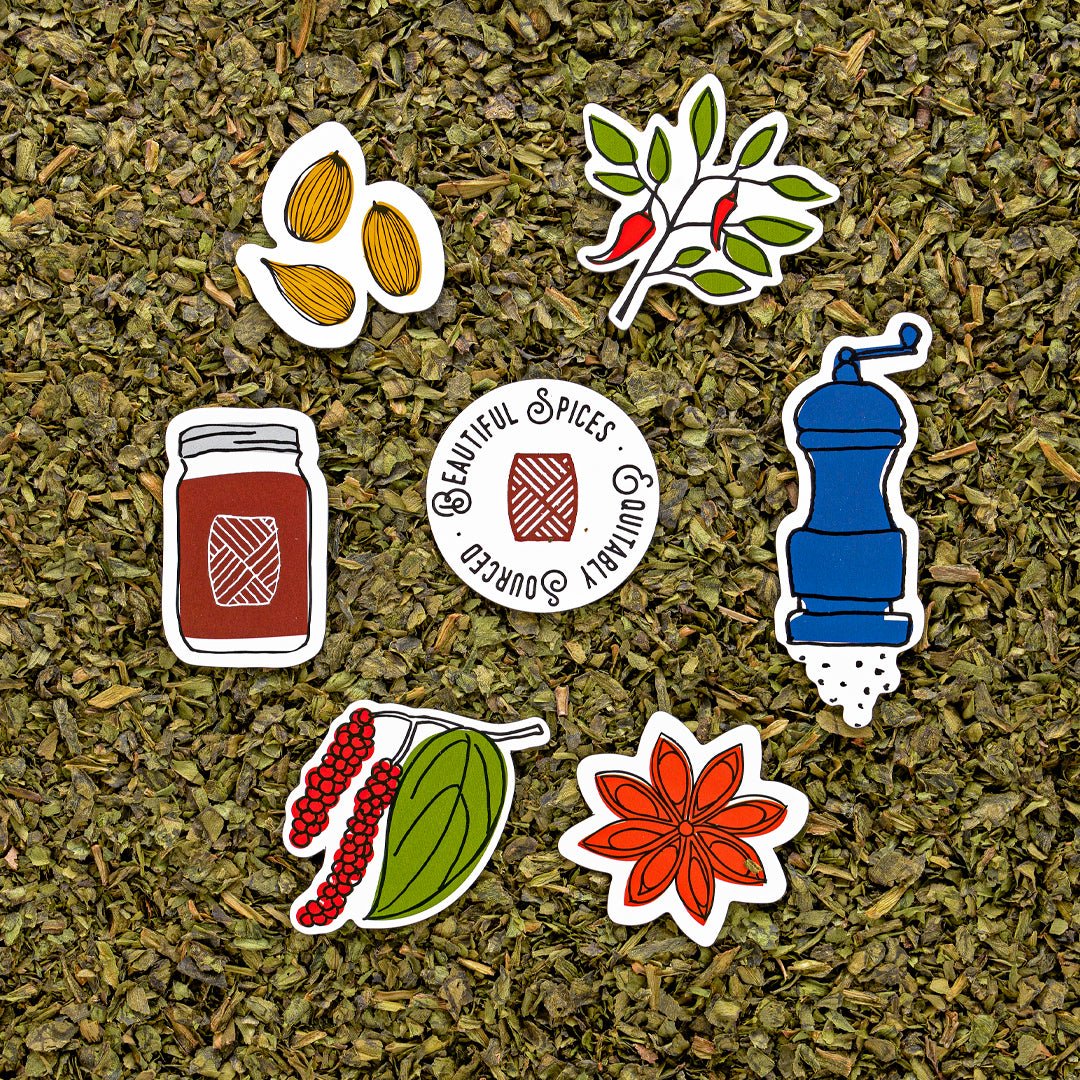 Beautiful Spices branded stickers on dried herbs background featuring almonds, chili peppers, peppercorn berries, spice jar, grinder, and star anise.