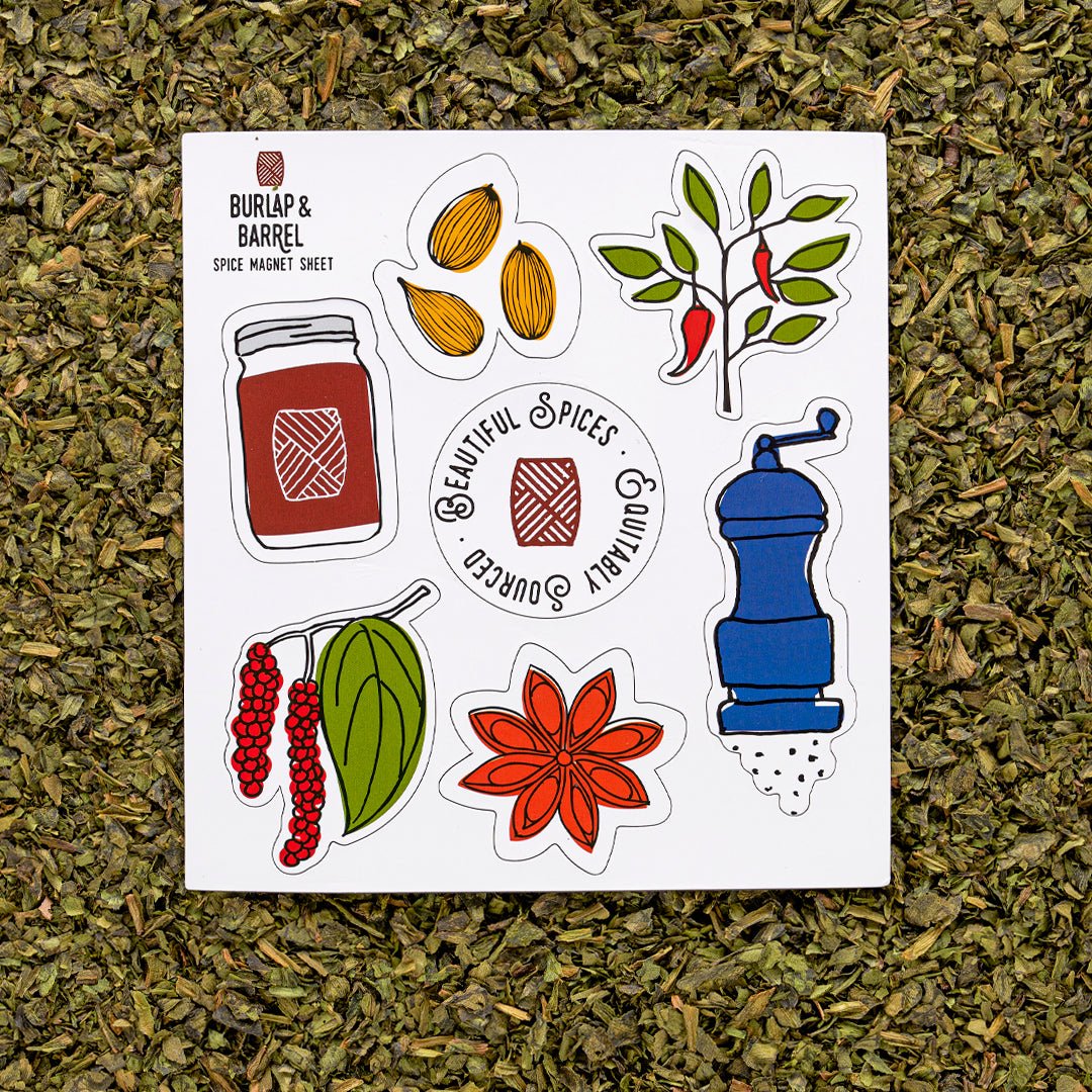 Burlap & Barrel spice magnet sheet with illustrated jars, almonds, peppers, peppercorns, star anise, and pepper mill.