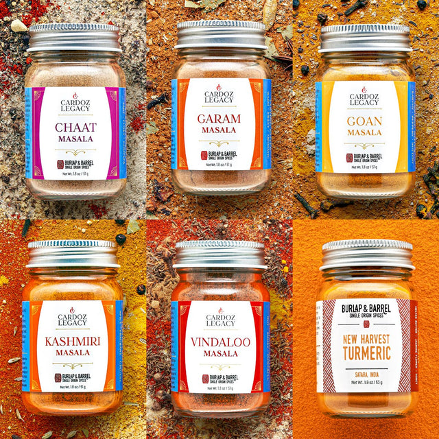 Collection of Cardoza Legacy spice jars on a textured orange background