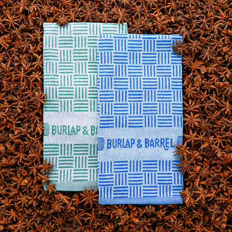 Two patterned towels from Burlap & Barrel on a star anise background