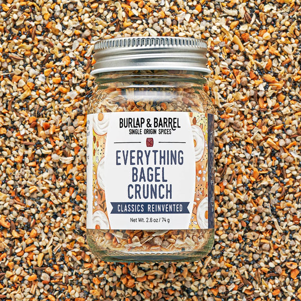 Jar of 'Everything Bagel Crunch' seasoning mix on a textured surface