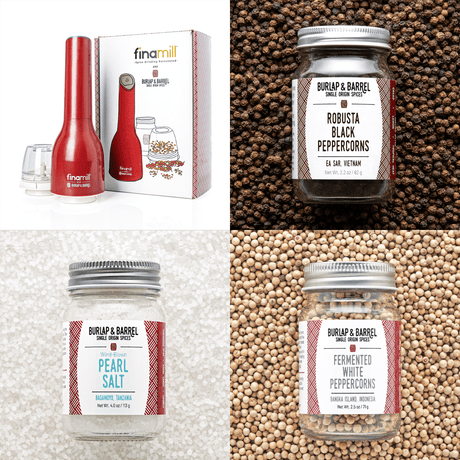 A red Finamill spice grinder with its packaging, displaying the product name and features, alongside three glass jars of spices.