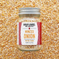 Jar of minced onion spice with 'Burlap & Barrel' label on a textured background