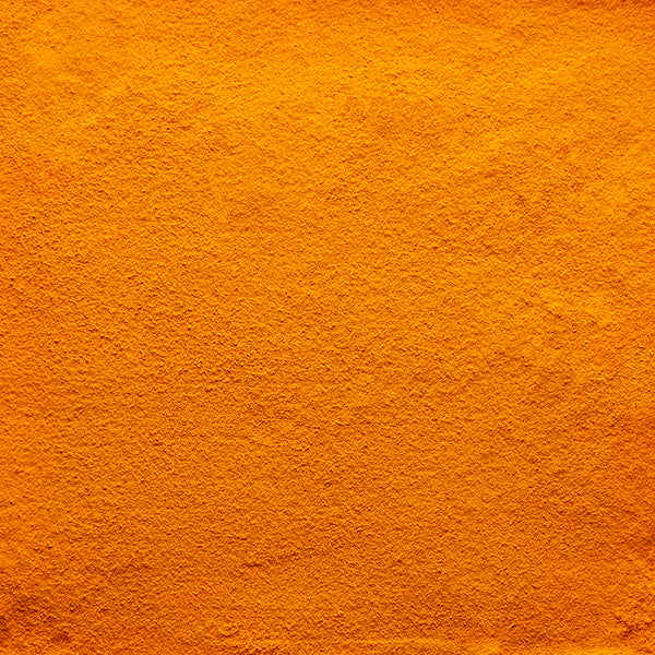 background of loose new harvest turmeric powder