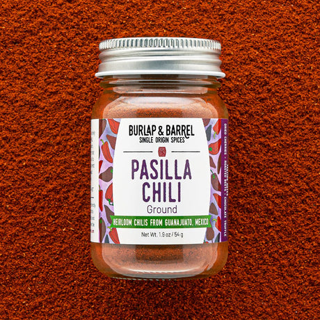 Jar of Burlap & Barrel Pasilla Chili on a textured brown background