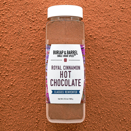 Bottle of Burlap & Barrel Royal Cinnamon Hot Chocolate on a brown background