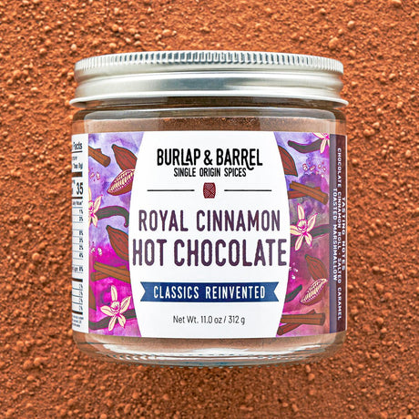 Jar of Burlap & Barrel Royal Cinnamon Hot Chocolate on a brown background