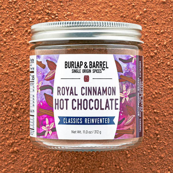 Jar of Burlap & Barrel Royal Cinnamon Hot Chocolate on a brown background