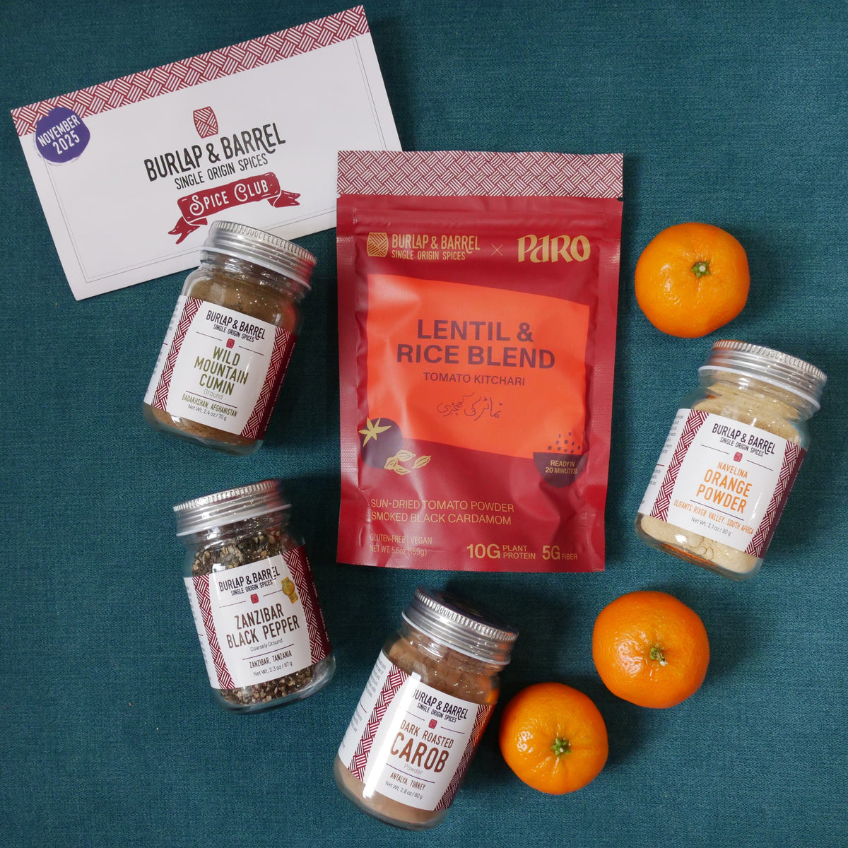 Spices and a package of lentil and rice blend on a teal background